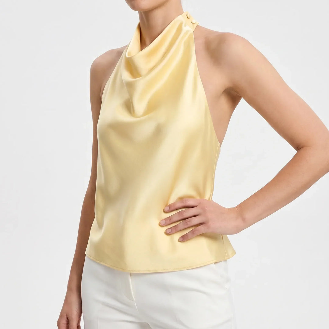 Stylish women's backless halter top, draped neckline, elegant sleeveless for summer evenings.
