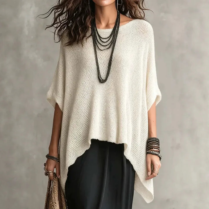 Women's draped poncho top with boat neck, perfect for casual and stylish layering. Comfortable oversized blouse.