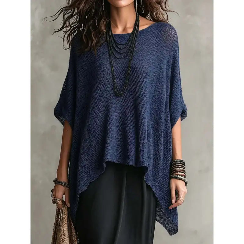 Chic women's boat neck poncho blouse, draped & oversized for modern comfort. Ideal casual layering top.