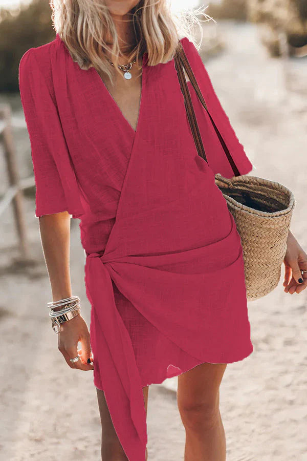 Chic women's V-neck mini dress with elegant draping, ideal for casual outings, beach, or everyday style.