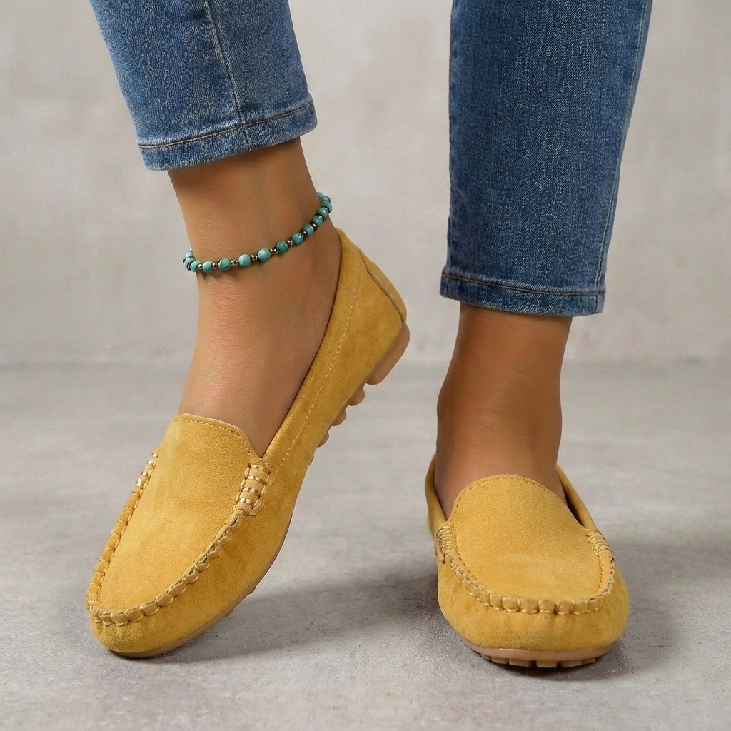Women's driving moccasins with metallic accent & orthopedic sole for comfort.