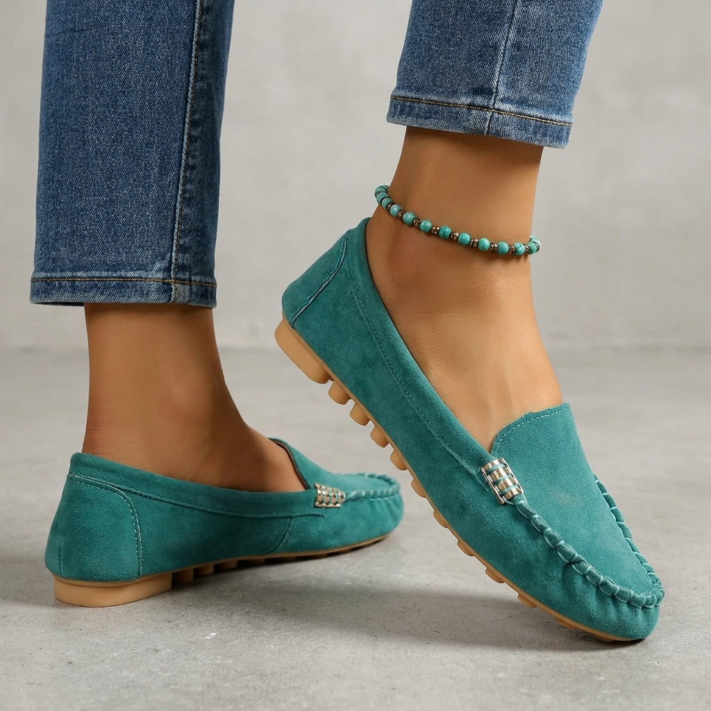 Casual women's driving moccasins with a fashionable metallic accent and supportive orthopedic sole.