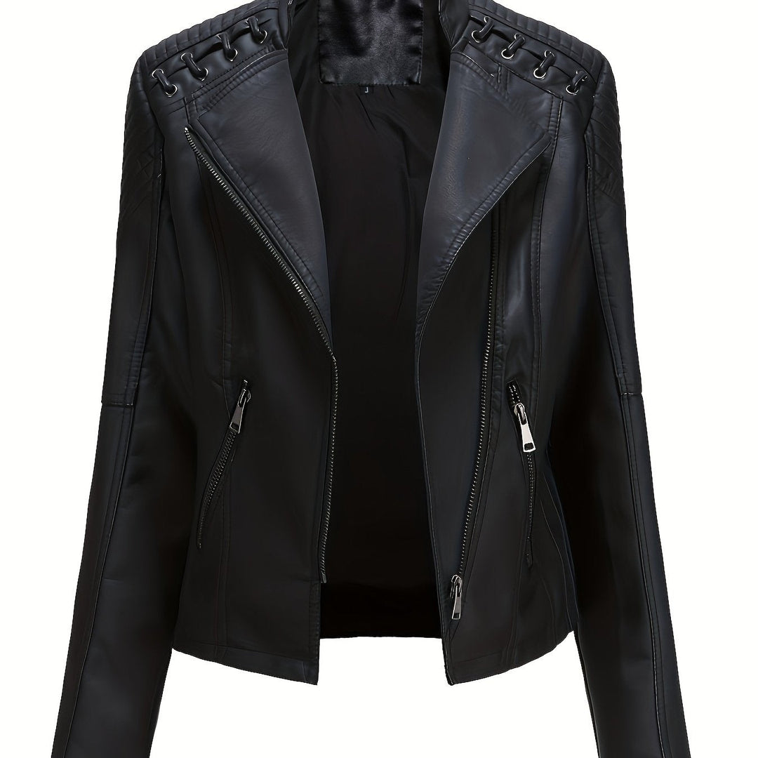 Detail shot of the black material and metal studs on a women's moto jacket.