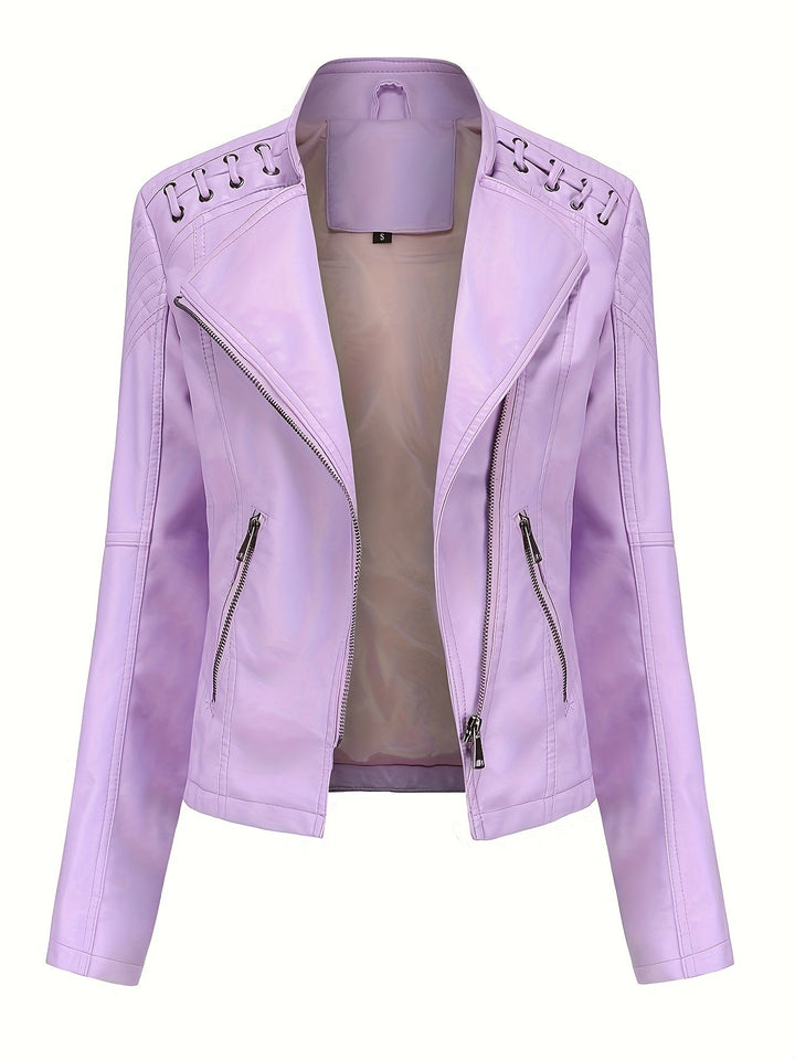 Close-up of women's black moto jacket, highlighting studded shoulders and faux leather.