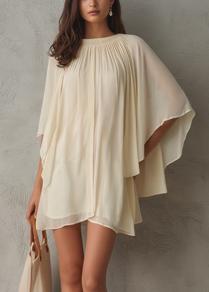 Chic women's beige mini dress with graceful cape sleeves, a versatile A-line design for summer parties & casual outings.