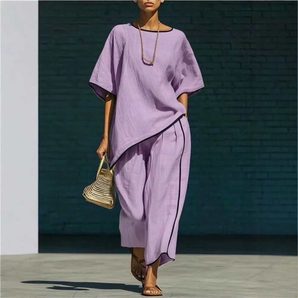 Pink women's cropped pant and top set. Relaxed fit, versatile two-piece outfit for ultimate comfort and travel style.