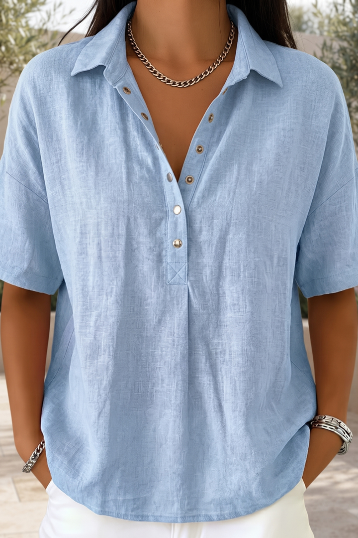 Chic women's button blouse, a versatile long-sleeve top for a polished look, suitable for work or leisure.