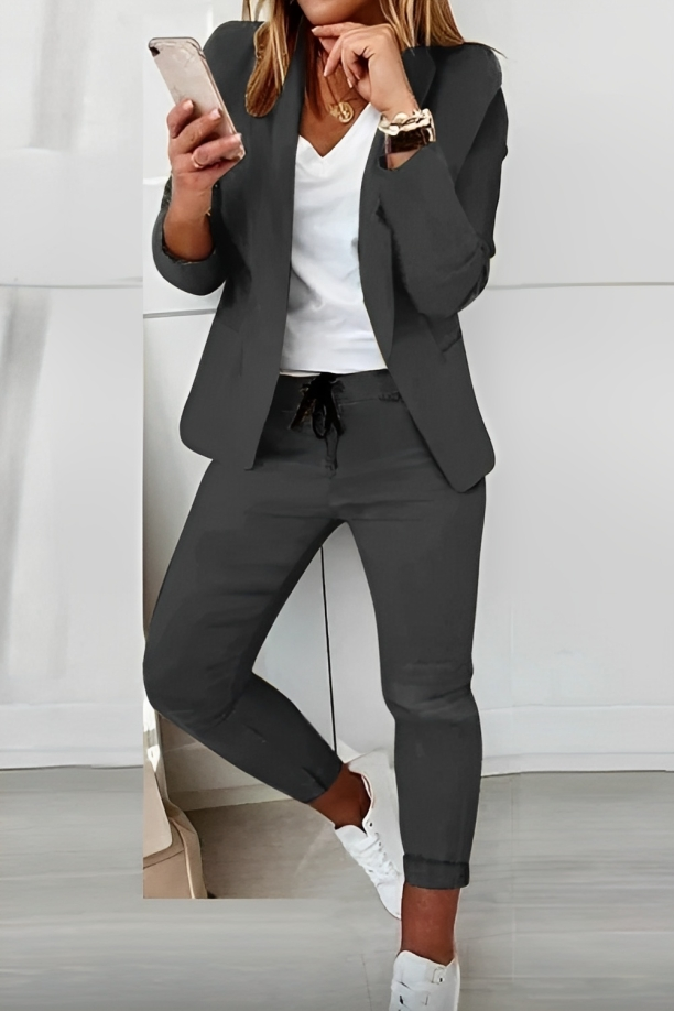 Women's Effortless Chic two-piece suit: modern blazer and matching pants. Perfect for work or casual fashion.
