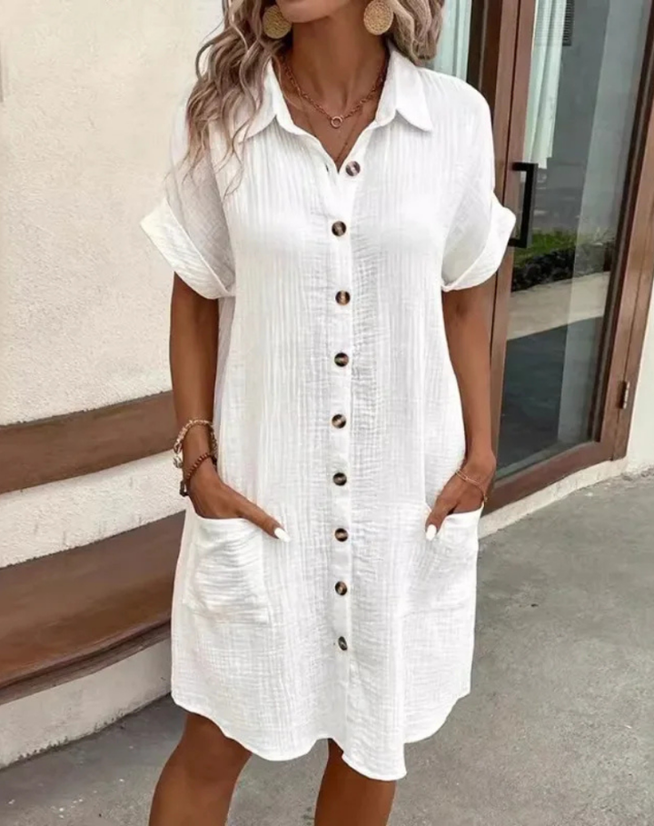 Women's effortless collared button-down mini shirt dress, perfect for casual spring/summer wear.
