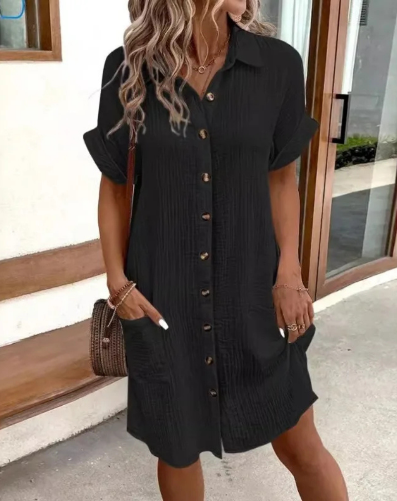Casual women's mini shirt dress with collared button-down front. Ideal for chic spring/summer outfits.