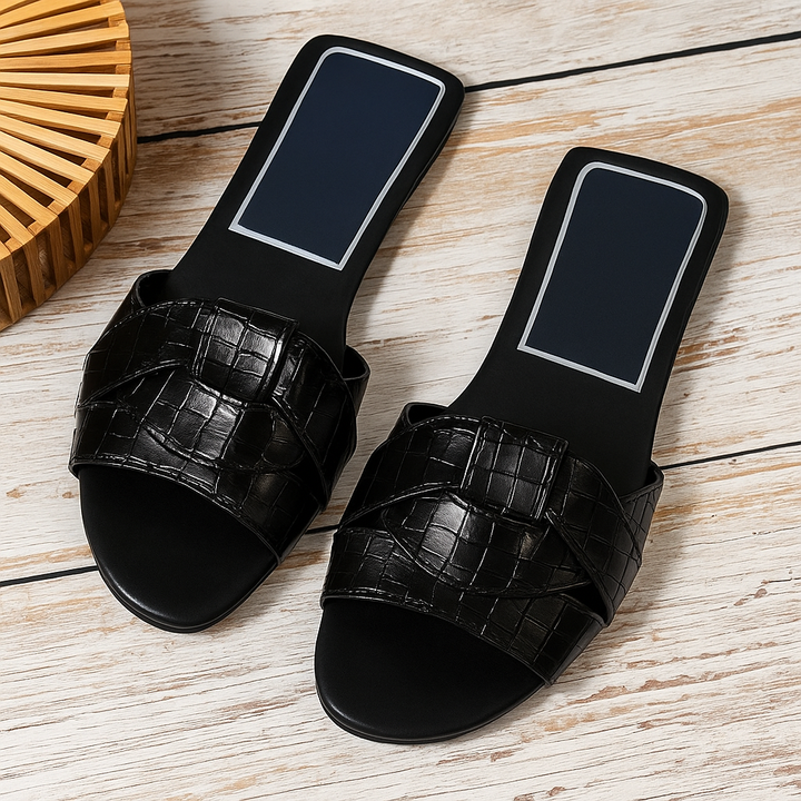 Stylish women's slip-on sandals with cushioned sole for ultimate comfort and support.