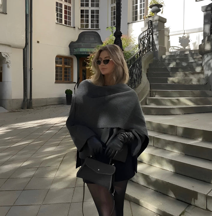 Chic women's draped cape coat, versatile outerwear with an asymmetrical design for modern elegance.