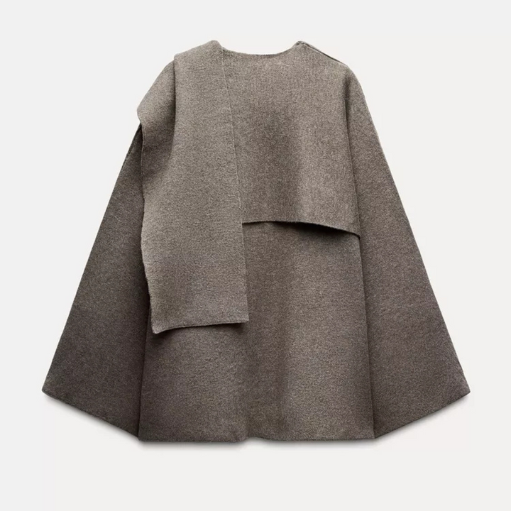 Elegant women's draped jacket, a versatile cape coat for transitional style and contemporary wear.