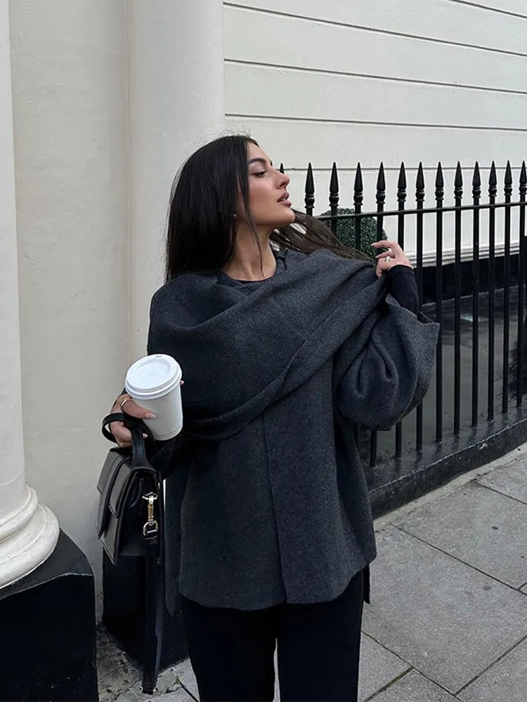 Modern women's wear: Effortless drape cape coat, a chic and versatile piece for fall fashion.