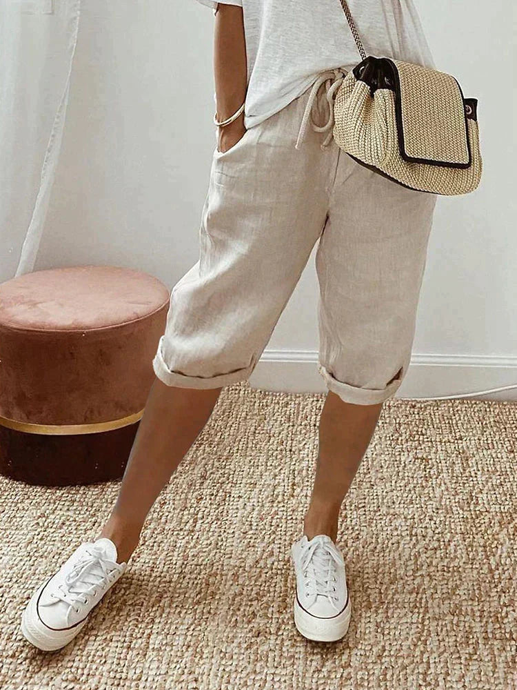 Versatile women's summer shorts with elastic drawstring waist & practical pockets, ideal for loungewear or daily tasks.