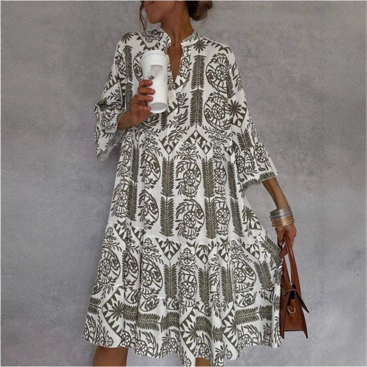 Chic women's floral sundress with tiered skirt & relaxed fit, ideal for summer vacation style.
