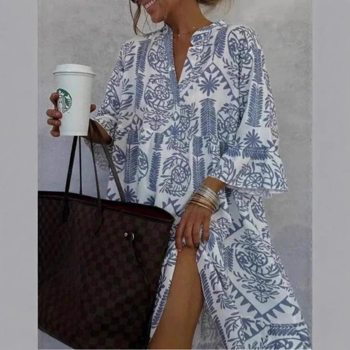 Comfortable women's floral print sundress, tiered skirt, elbow sleeves & relaxed fit for warm weather.