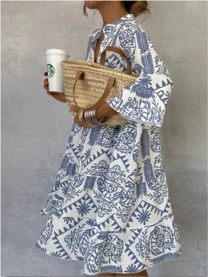 Boho chic women's floral sundress featuring a tiered skirt, elbow sleeves, perfect for summer vacation.