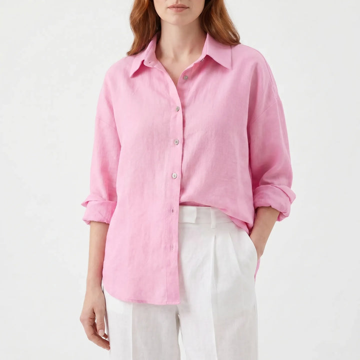 Lightweight women's oversized button-down shirt, long sleeve, showcasing soft fabric & relaxed drape for comfort.