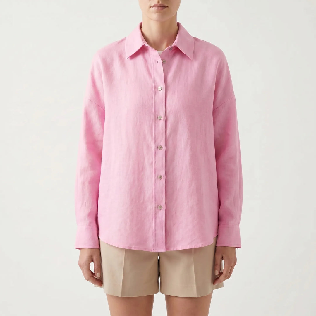 Back view of a women's oversized button-down shirt, long sleeve, showing relaxed fit and effortless design.