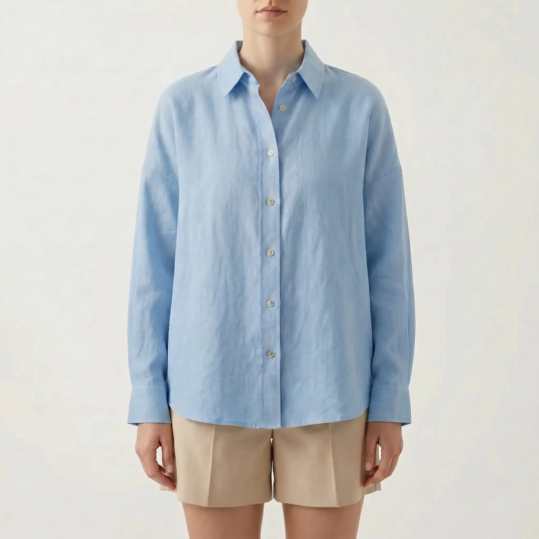 Effortless women's oversized long sleeve button-down shirt, ideal for a relaxed, chic summer fashion look.