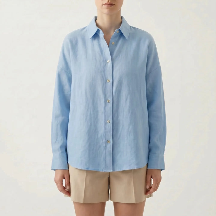 Effortless women's oversized long sleeve button-down shirt, ideal for a relaxed, chic summer fashion look.