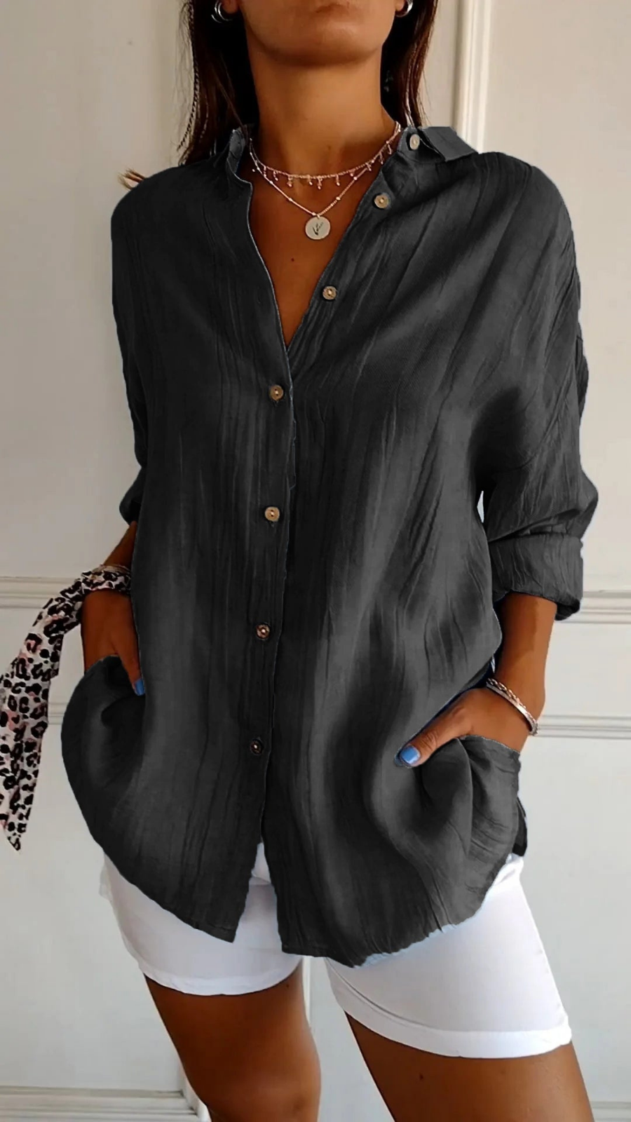 Chic women's relaxed fit button-up shirt, collared and versatile for an effortless look.