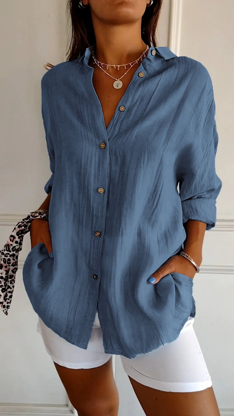 Effortless women's long sleeve button-up shirt, oversized & comfortable for daily wear.