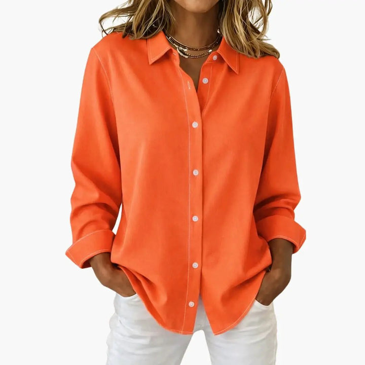 Back view: Women's relaxed fit long sleeve button-up blouse, perfect for a chic, casual ensemble.