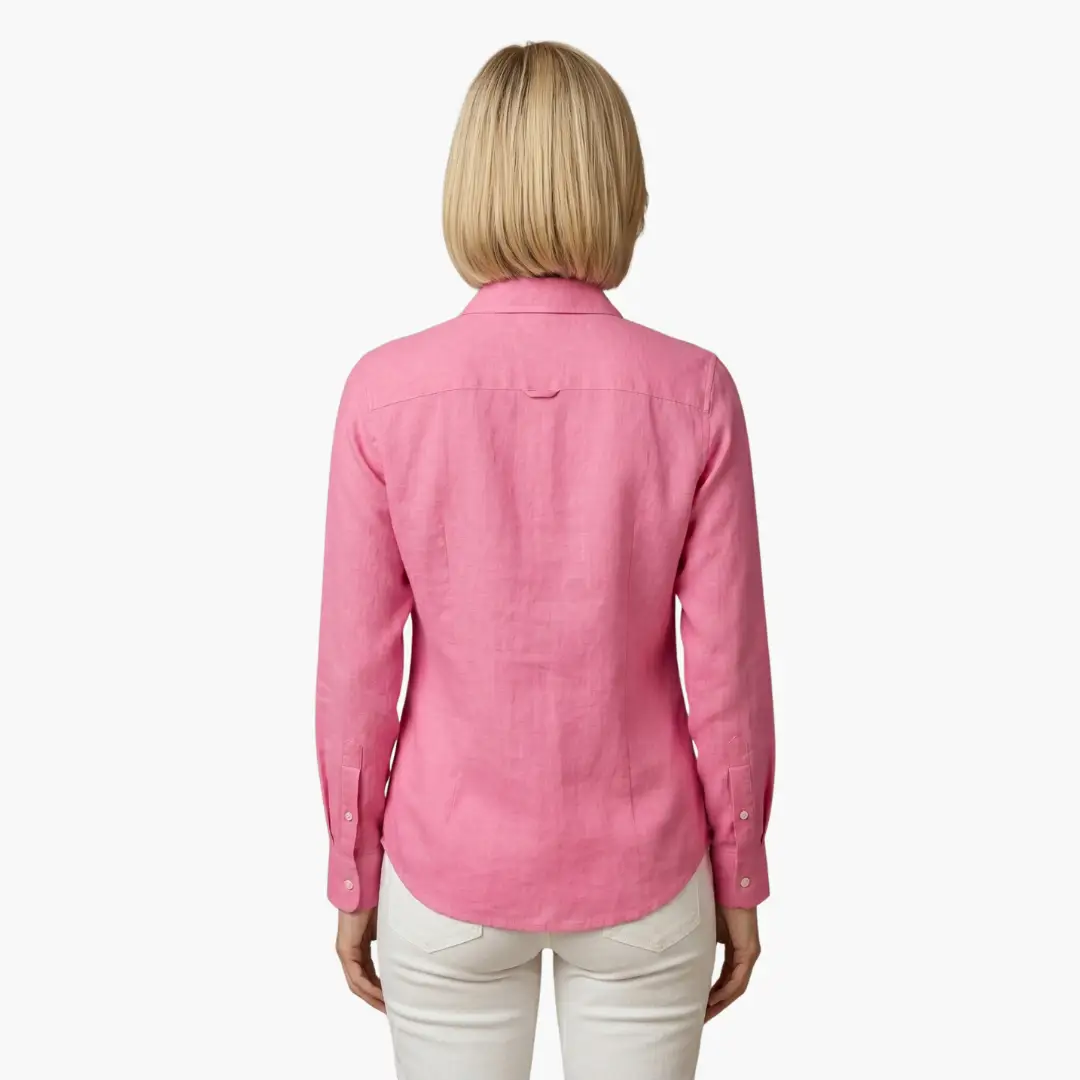 Woman wearing an effortless, relaxed fit long sleeve button-up shirt, styled casually.