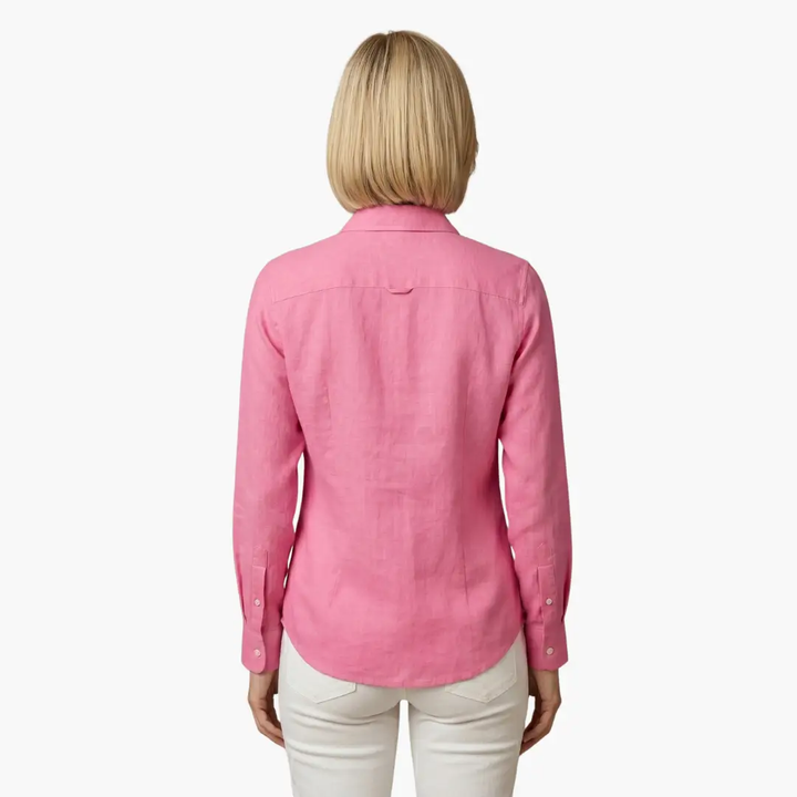 Woman wearing an effortless, relaxed fit long sleeve button-up shirt, styled casually.