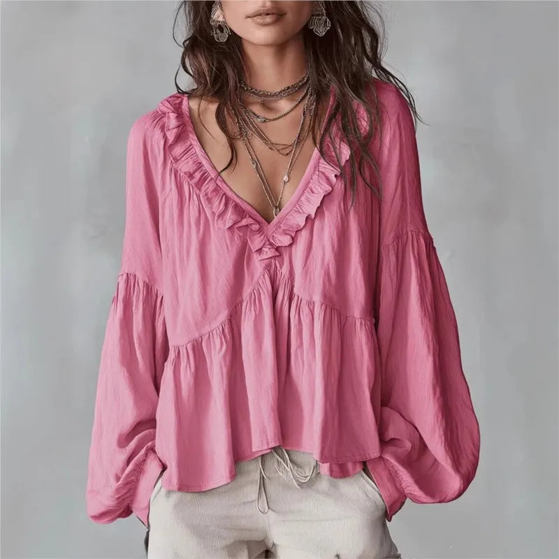 Stylish women's ruffle V-neck blouse with puff sleeves. A versatile, effortless top for spring/summer fashion.