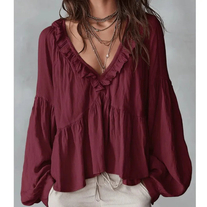 Fashionable women's ruffle blouse, a lightweight V-neck top with puff sleeves. Ideal for spring and summer casual wear.