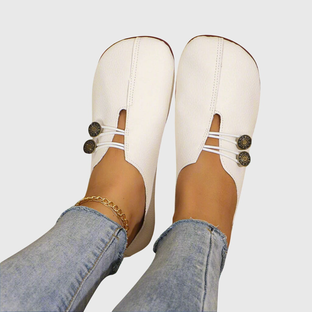 Textured women's slip-on flats, offering soft comfort and a barefoot feel. Features versatile toggle lace design.