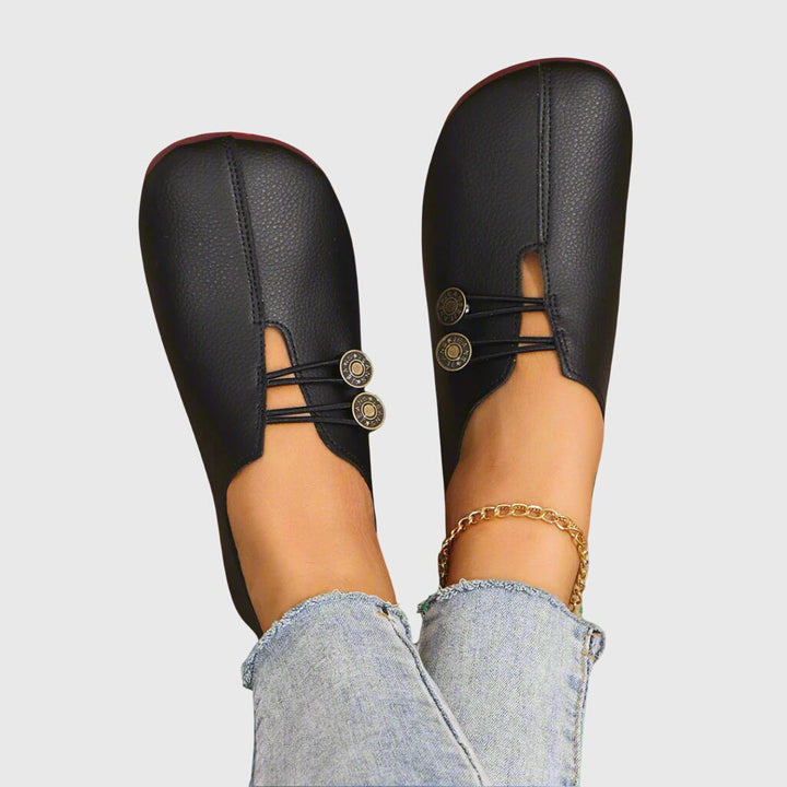 Pair of women's effortless slip-on flats with unique toggle lace, ensuring all-day comfort for casual walking.