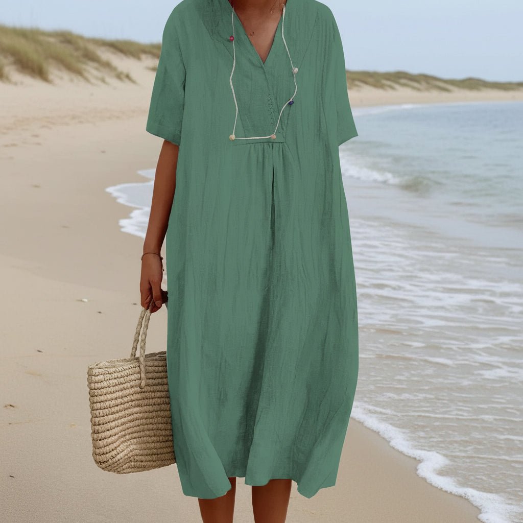 Effortless women's V-neck A-line summer midi dress. Breezy style offers comfort for vacation or casual wear.