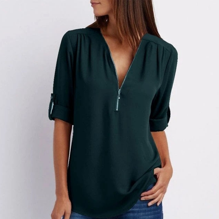 Model wearing a comfortable women's V-neck blouse with roll-up long sleeves for versatile daily comfort.