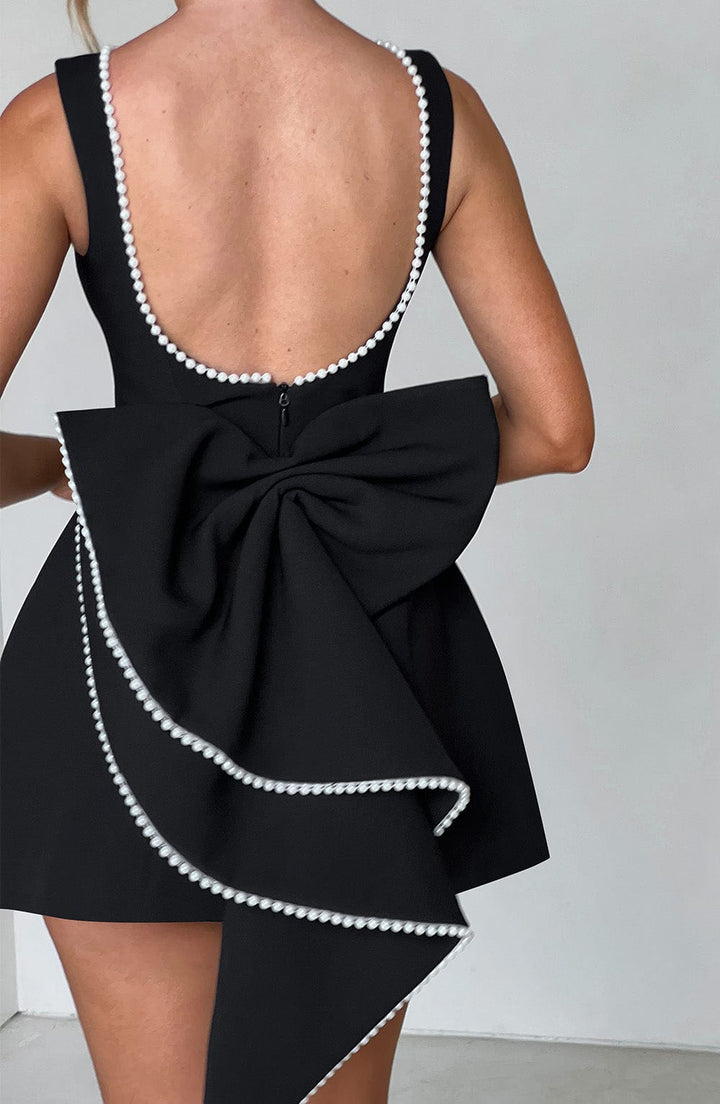 Sophisticated women's A-line mini dress with pearl trim and bow, an elegant special occasion or formal dress.