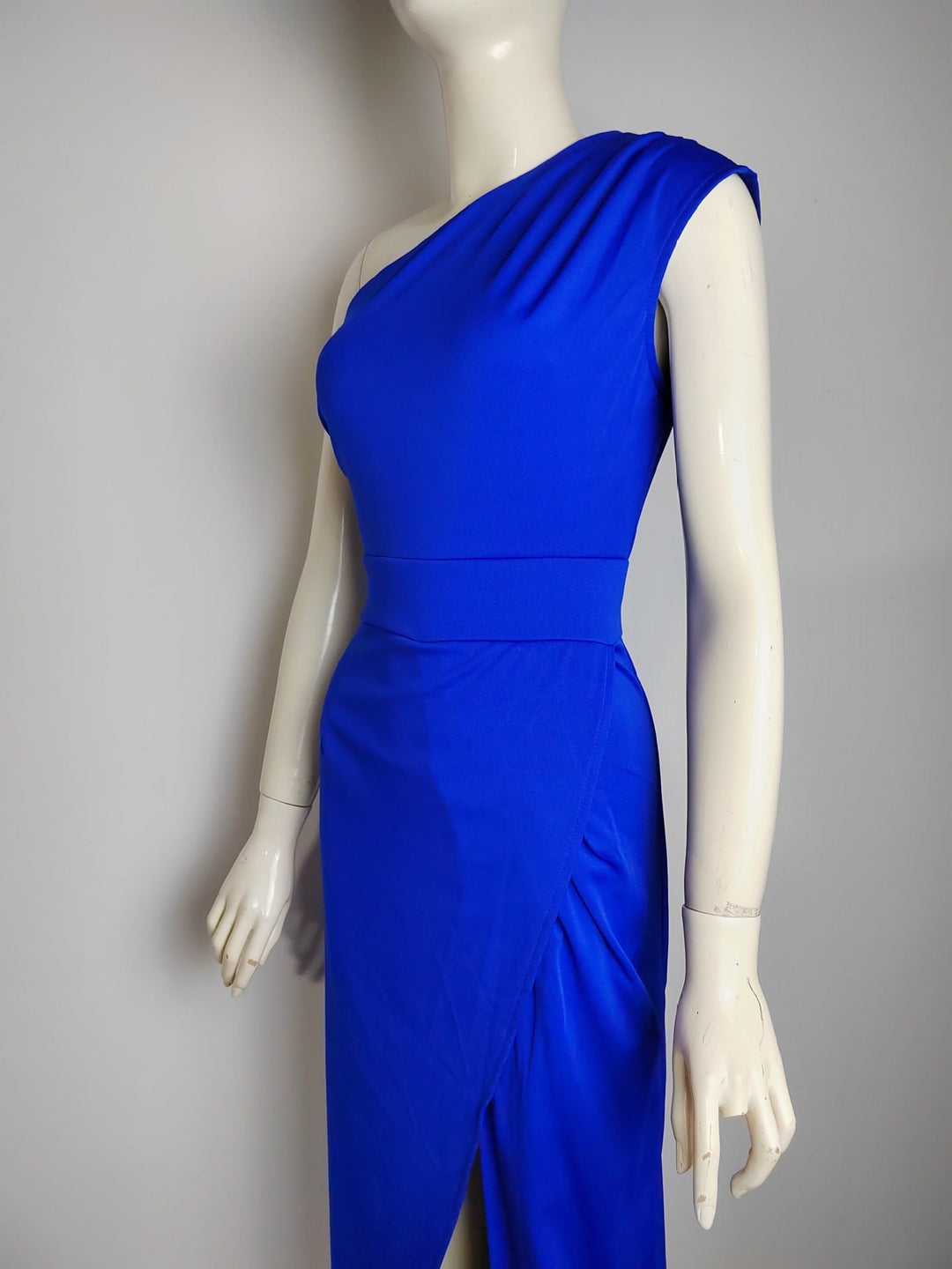 Women's formal maxi dress with unique asymmetrical design, elegant draping and a long silhouette.