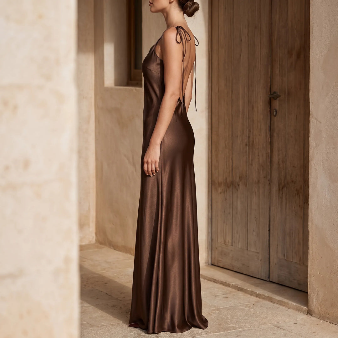Women's elegant backless floor-length slip dress for sophisticated evening events.