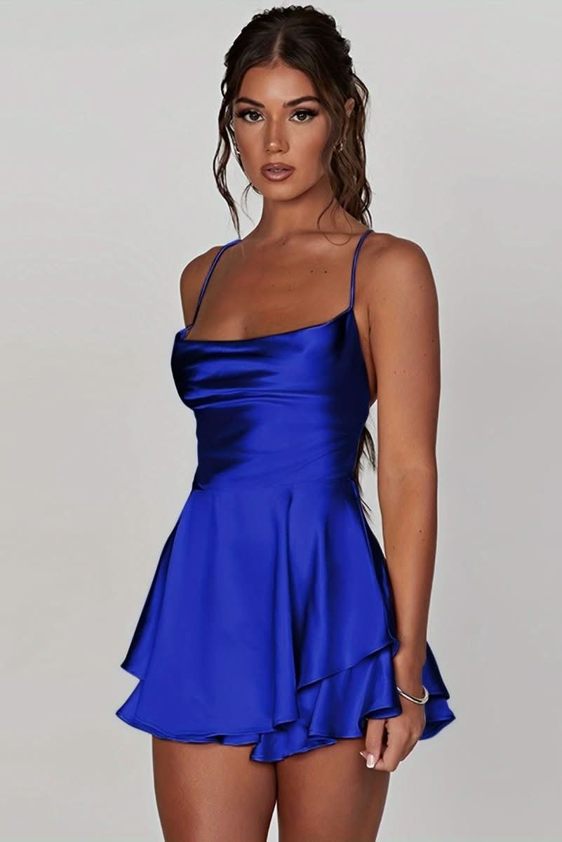 Close-up: Ruched fabric detail on an elegant women's backless halter cocktail dress.