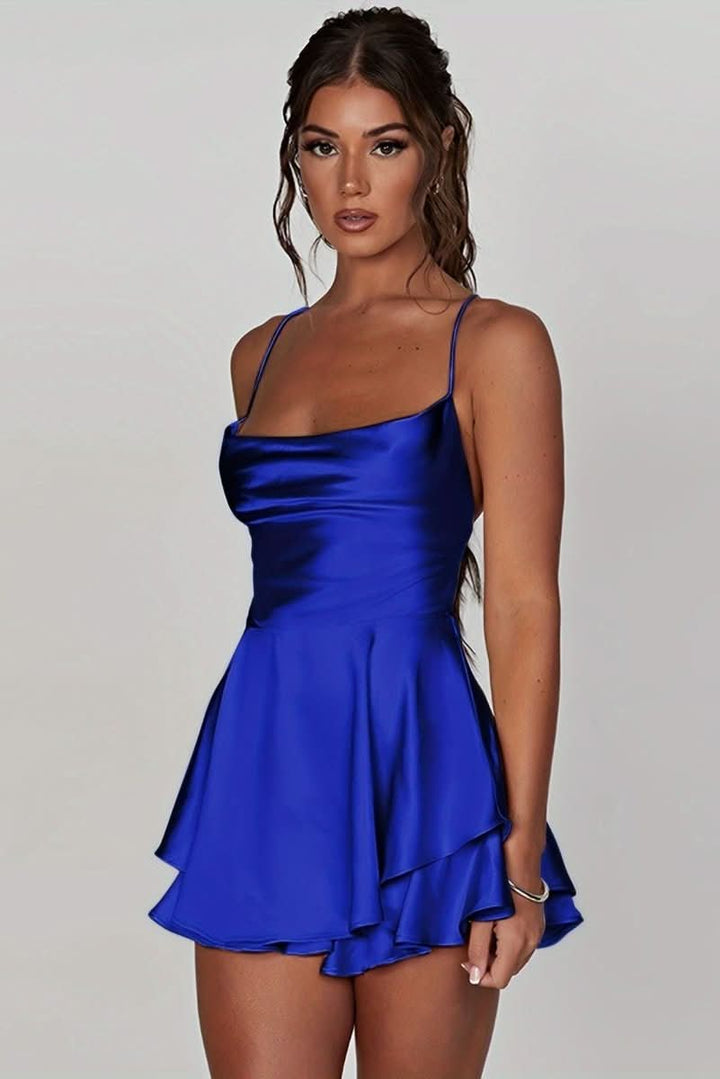 Close-up: Ruched fabric detail on an elegant women's backless halter cocktail dress.