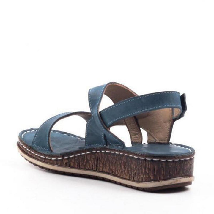Elegant women's summer footwear: comfortable wedge sandals with a chic platform design.