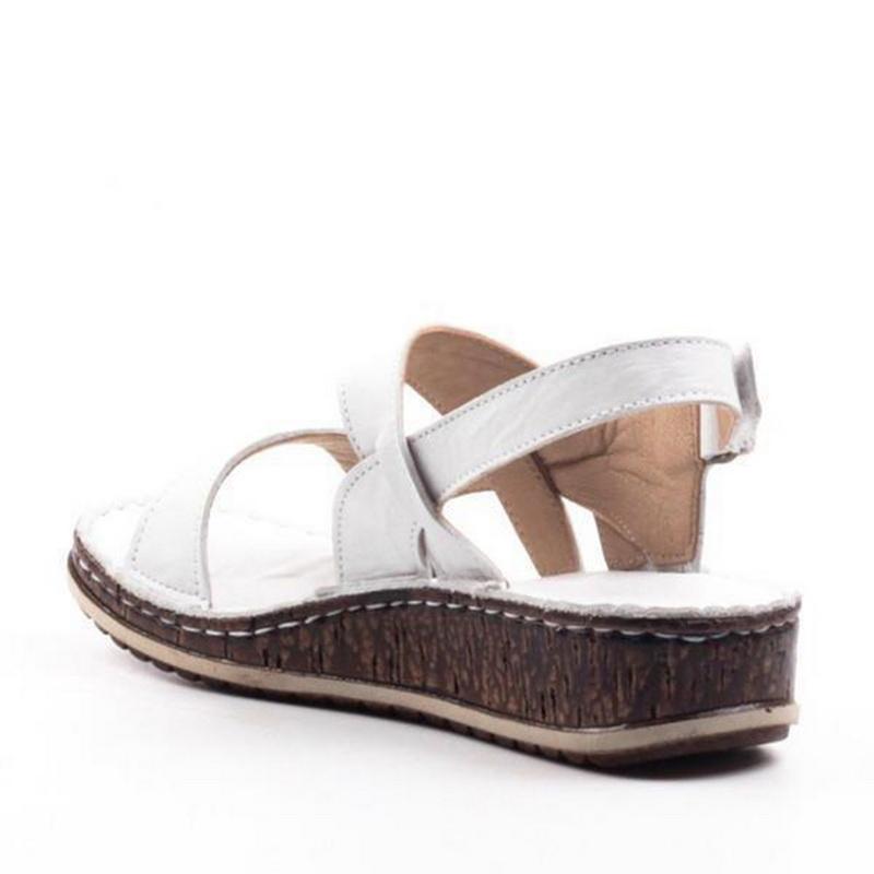 Women's elegant summer wedge sandals; chic, comfortable platform footwear for fashionable women.