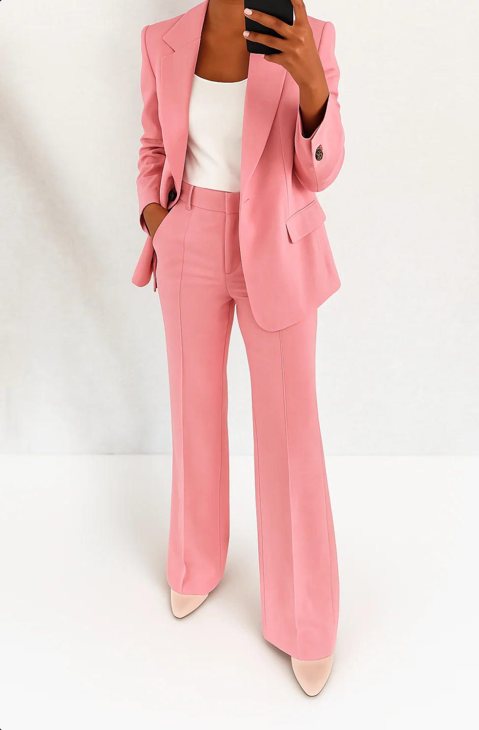 Two-piece women's formal suit set with a fitted blazer and flowy wide-leg pants, suitable for office & events.