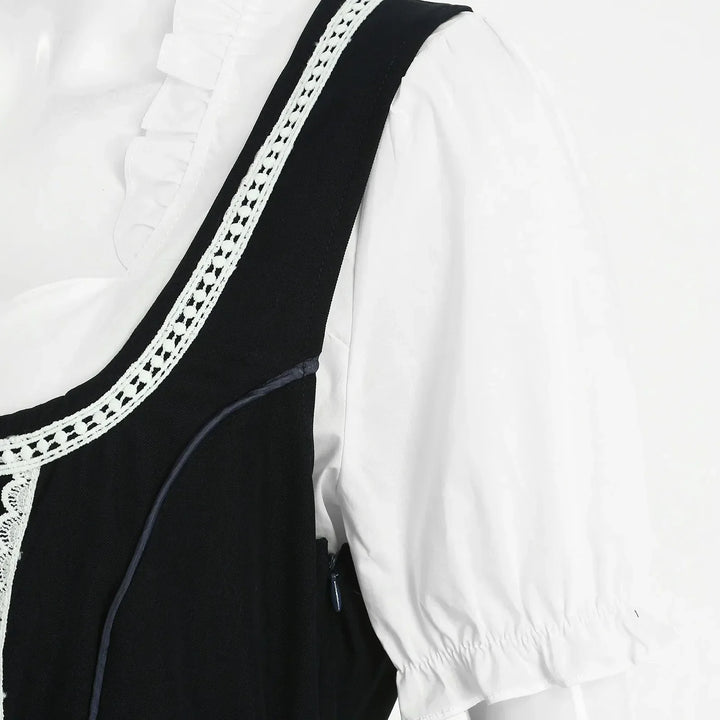 Festive women's Dirndl dress in a traditional style, complete with a blouse, bodice, and decorative apron.