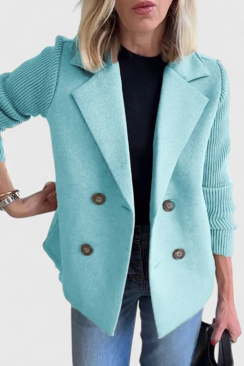 Tailored women's double-breasted blazer, a sophisticated piece for work and stylish layering.