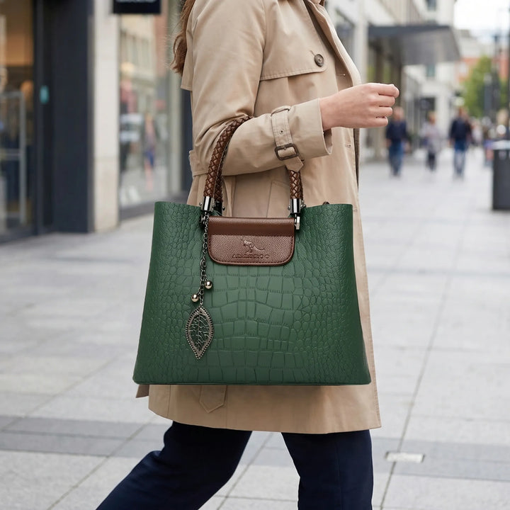 Women's elegant embossed tote bag with unique braided handle. Stylish shoulder handbag for daily use.