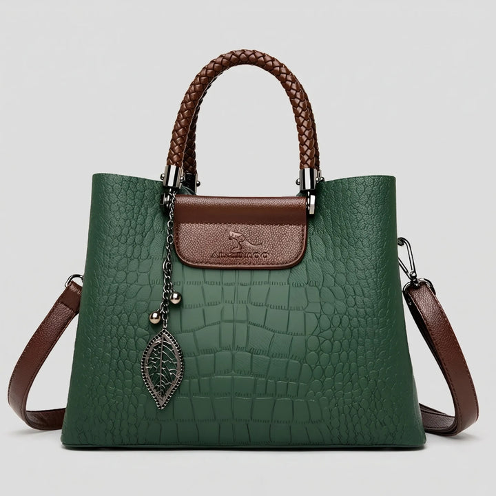 Green embossed women's tote bag. Features a chic braided handle and spacious interior. Versatile daily shoulder bag.