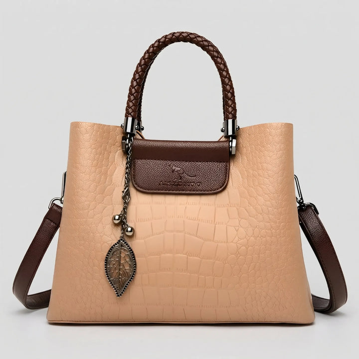 Beige embossed women's shoulder bag. Elegant daily tote with a braided handle, perfect as a stylish accessory.